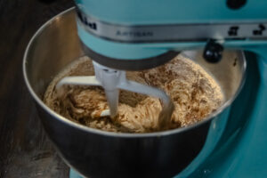 Mixing butter, eggs, and sugar in a stand mixer